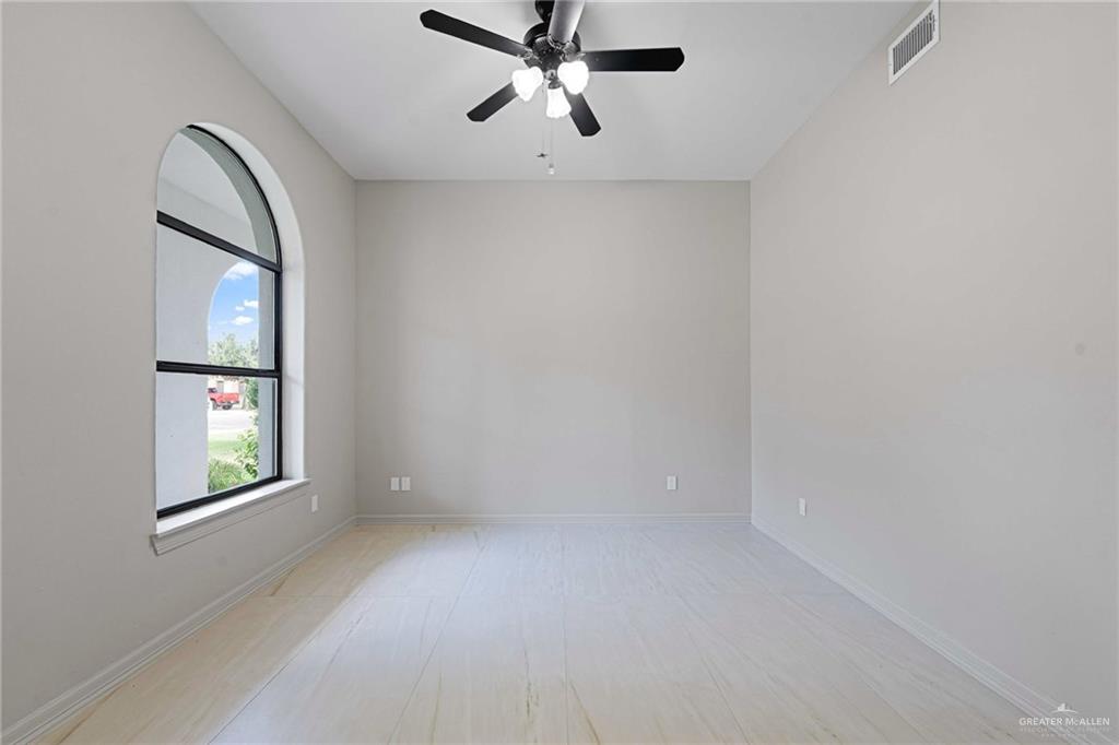 2216 South 45th Street McAllen, TX 78503 - Photo 22 of 34 an empty room with windows and fan view