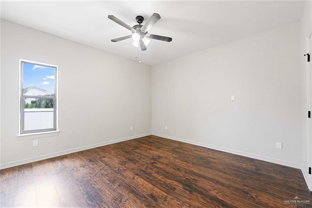 2216 South 45th Street McAllen, TX 78503 - Photo 26 of 34 an empty room with wooden floor and windows