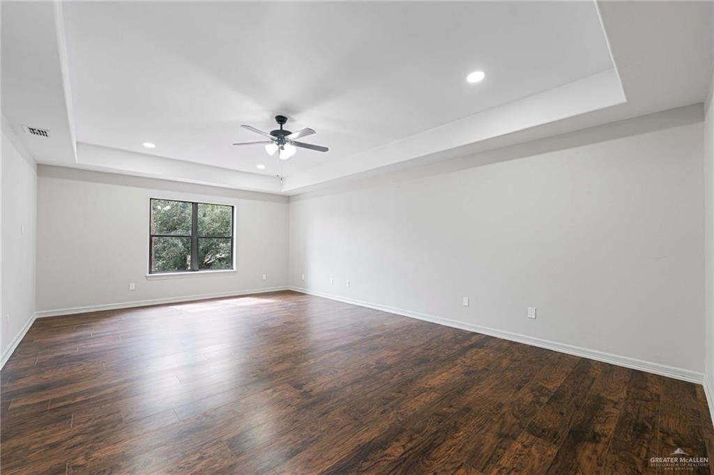 2216 South 45th Street McAllen, TX 78503 - Photo 28 of 34 wooden floor in an empty room with a window