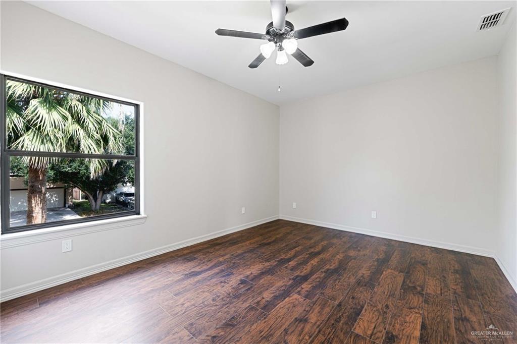2216 South 45th Street McAllen, TX 78503 - Photo 30 of 34 a view of empty room with wooden floor and fan