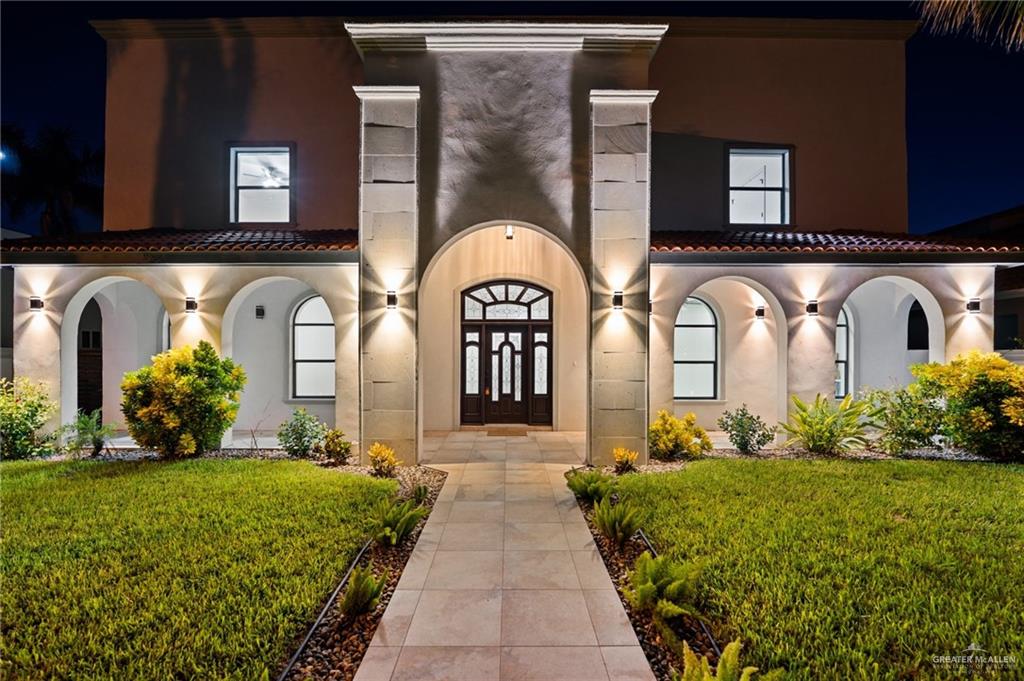 2216 South 45th Street McAllen, TX 78503 - Photo 32 of 34 a front view of a house with garden