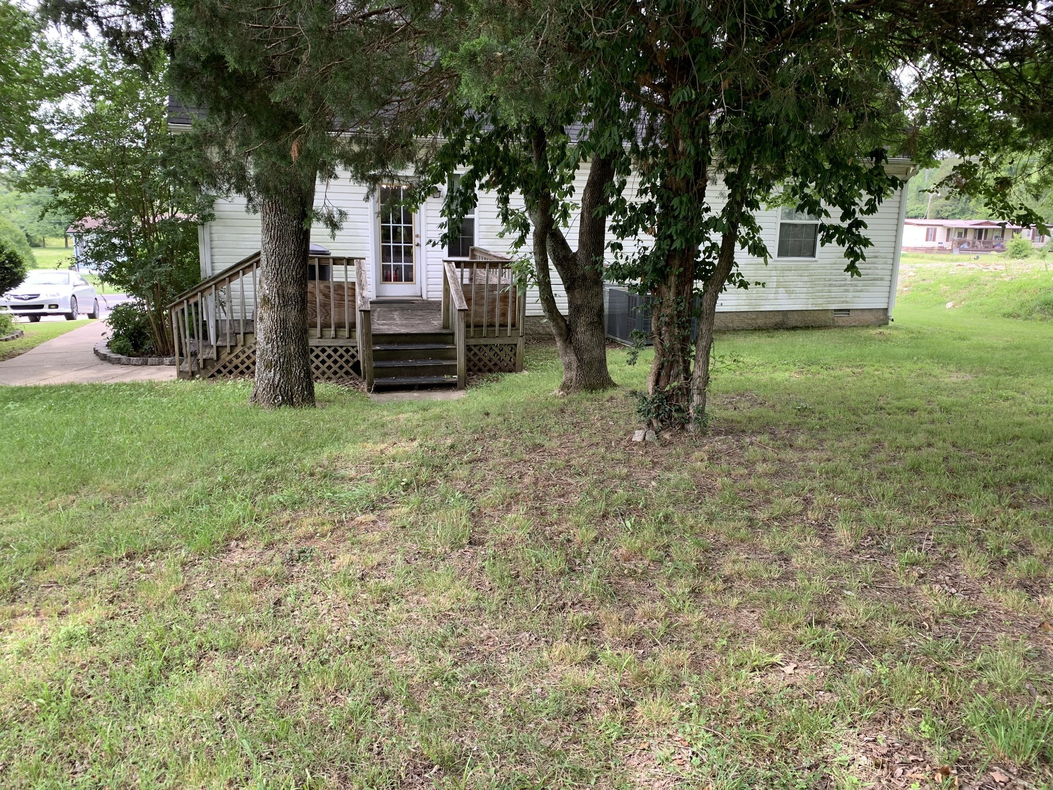 773 Curd Road Mount Juliet, TN 37122 - Photo 18 of 25 a view of a tree in front of a white house