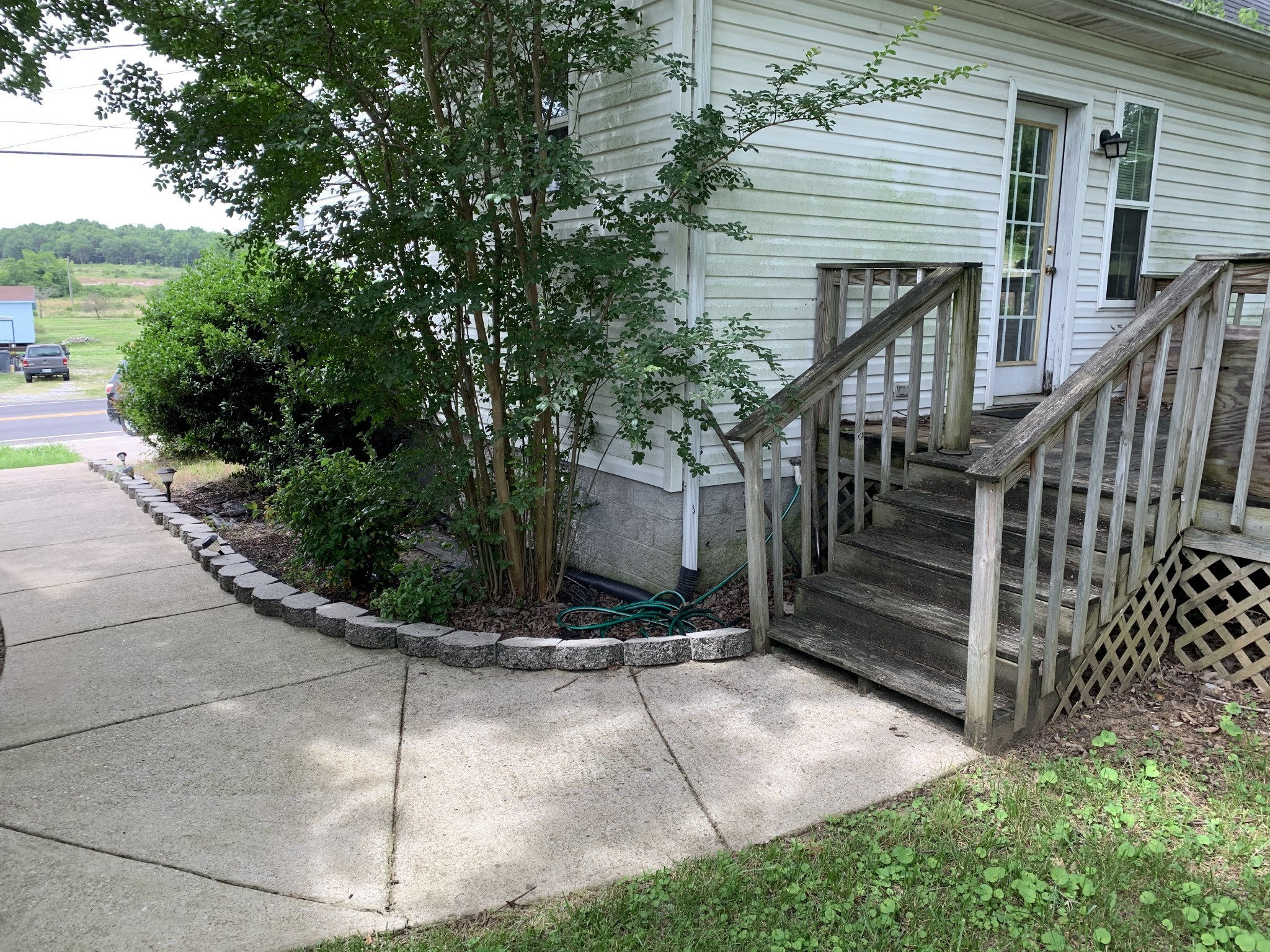 773 Curd Road Mount Juliet, TN 37122 - Photo 20 of 25 a view of a house with a small yard and wooden fence