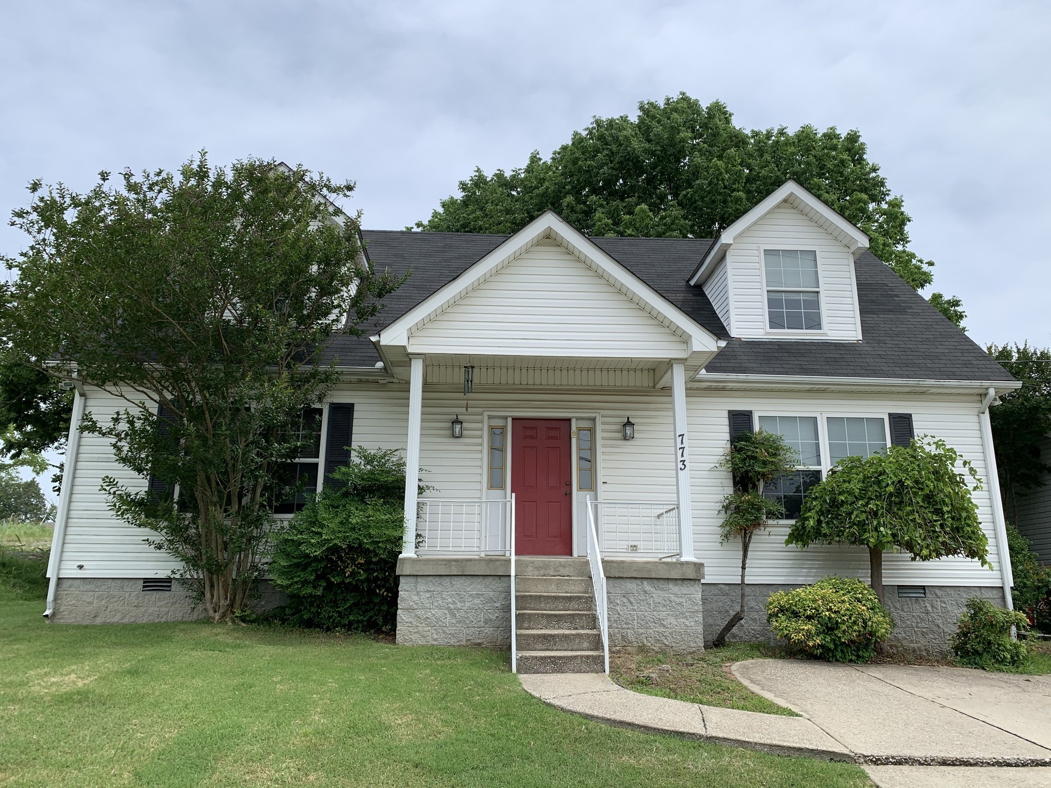 773 Curd Road Mount Juliet, TN 37122 - Photo 2 of 25 a front view of a house with a yard and garage