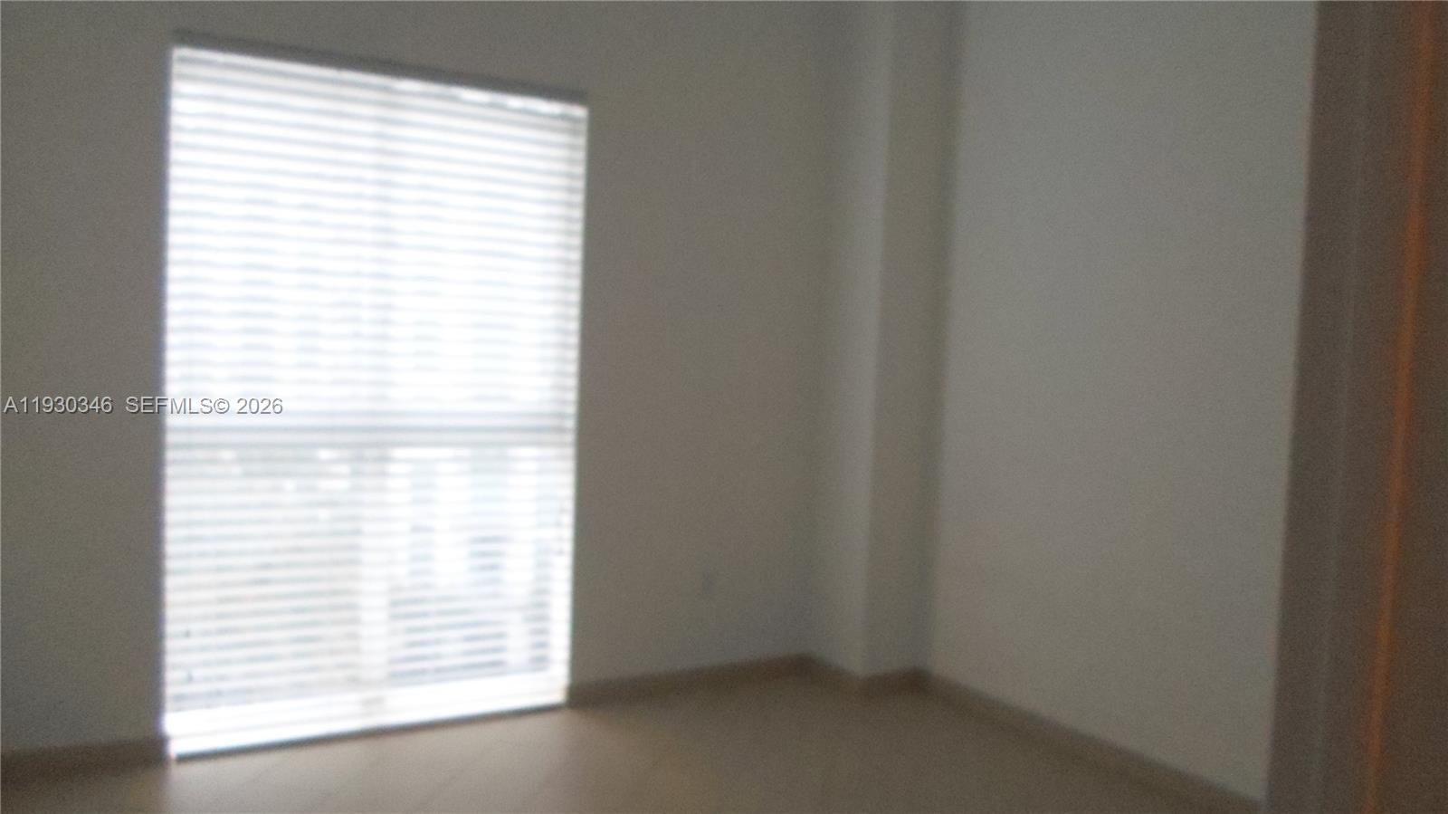 7275 Southwest 90th Way, Unit G 611 Miami, FL 33156 - Photo 11 of 56 a view of an empty room and a window