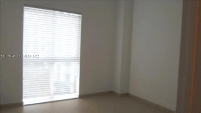 a bathroom with a granite countertop sink mirror and vanity