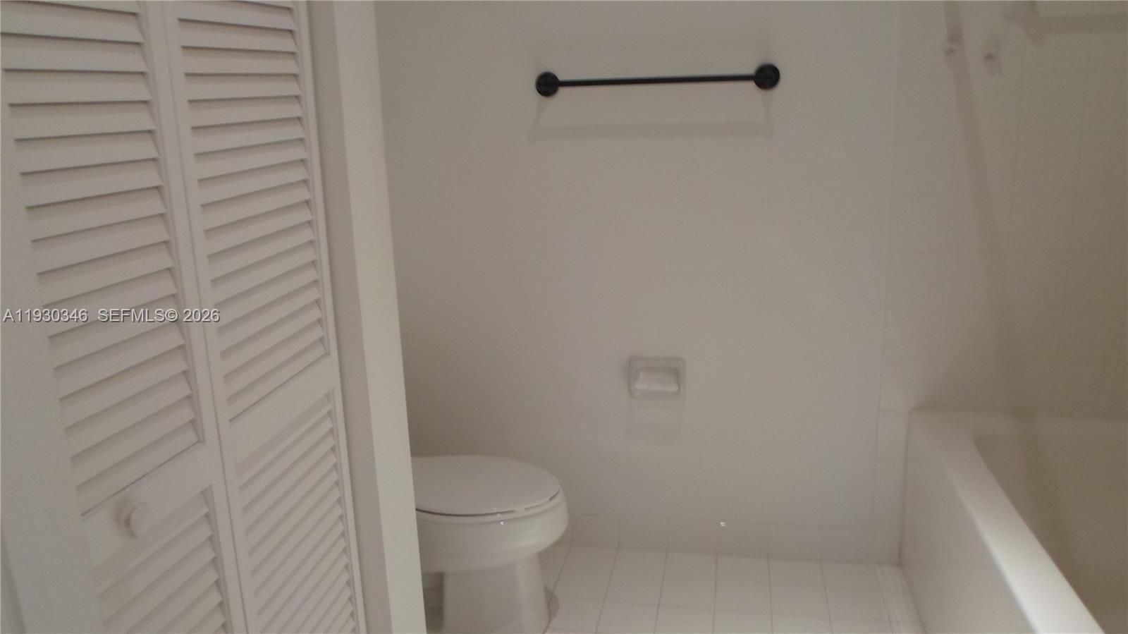 7275 Southwest 90th Way, Unit G 611 Miami, FL 33156 - Photo 14 of 56 a bathroom with a toilet and a shower