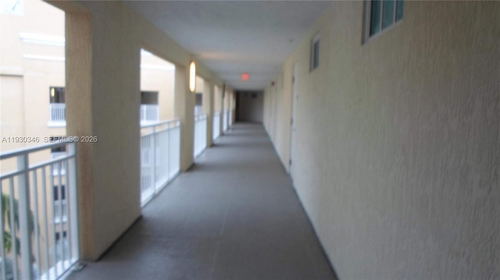 7275 Southwest 90th Way, Unit G 611 Miami, FL 33156 - Photo 18 of 56 a view of a hallway with windows