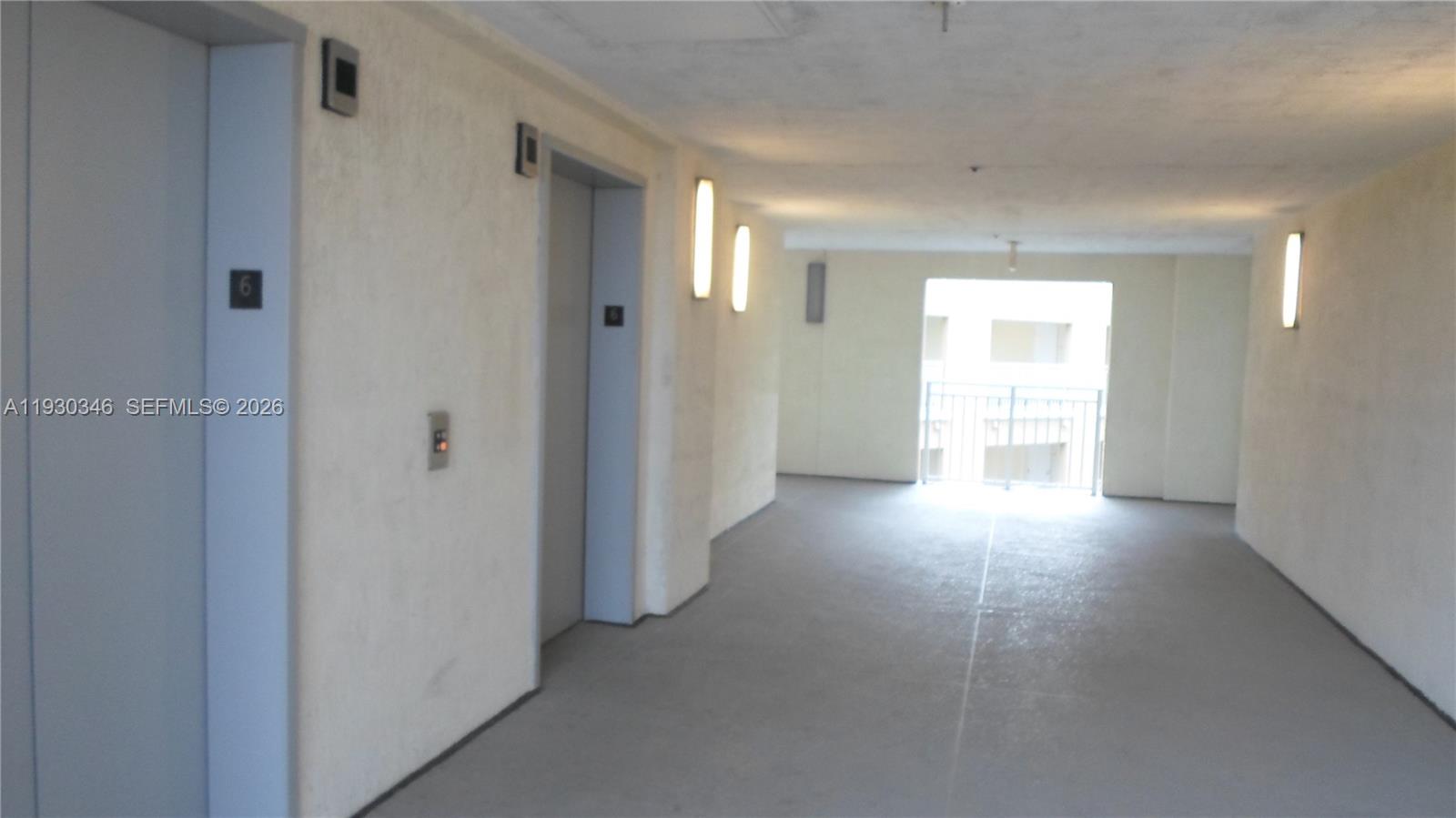 7275 Southwest 90th Way, Unit G 611 Miami, FL 33156 - Photo 20 of 56 a view of a hallway with wooden floor