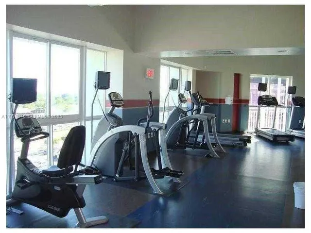 a kitchen with stainless steel appliances a sink and cabinets