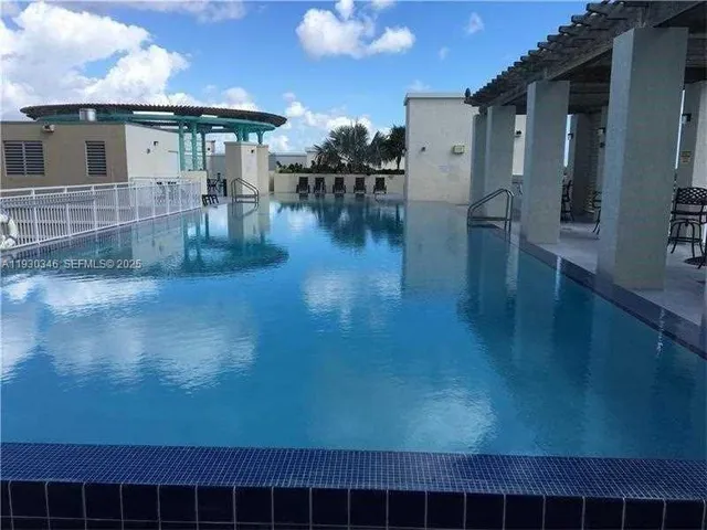 a kitchen with stainless steel appliances a sink stove and refrigerator