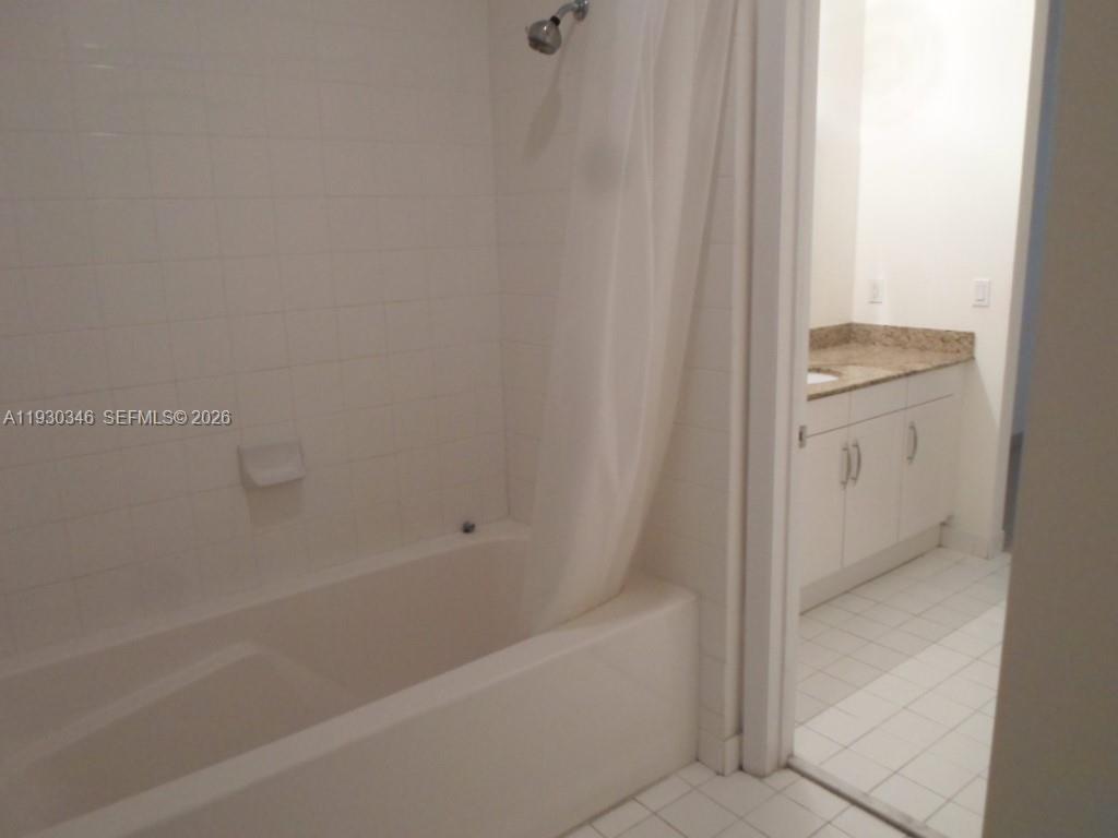 7275 Southwest 90th Way, Unit G 611 Miami, FL 33156 - Photo 35 of 56 a bathroom with a bathtub and a shower