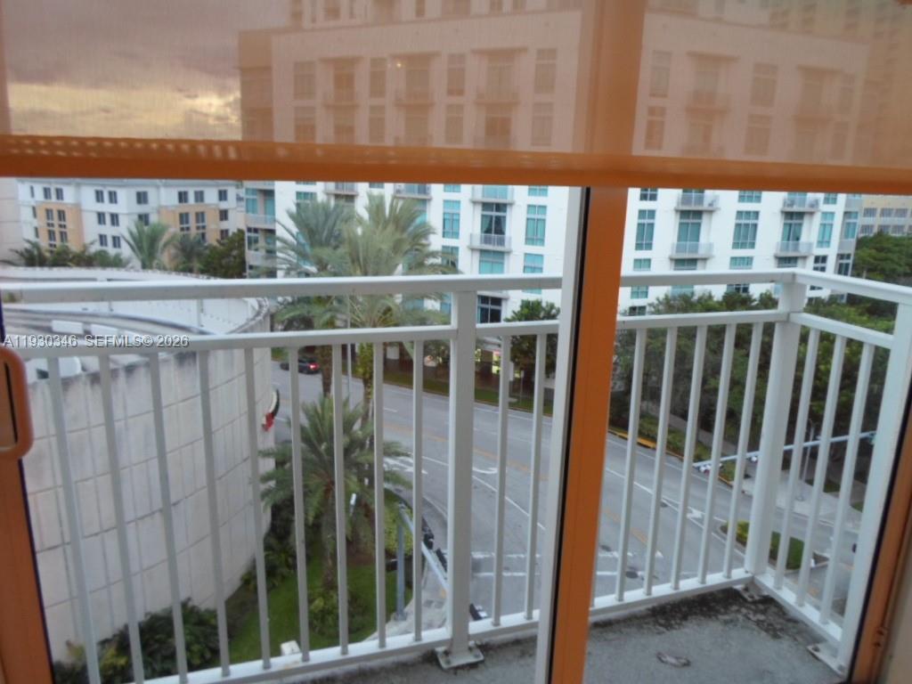 7275 Southwest 90th Way, Unit G 611 Miami, FL 33156 - Photo 39 of 56 a view of a building from a porch