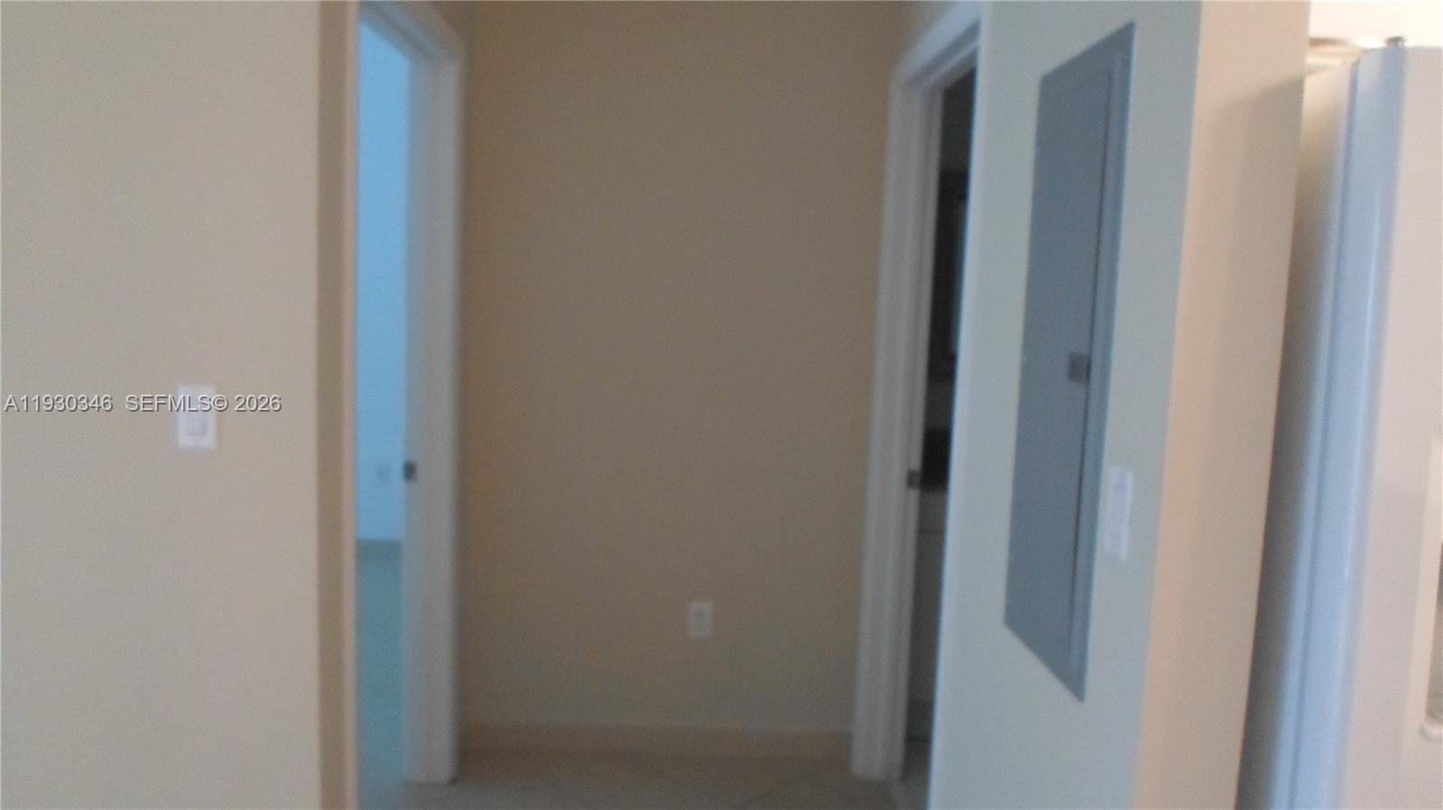 7275 Southwest 90th Way, Unit G 611 Miami, FL 33156 - Photo 9 of 56 a door with a hallway