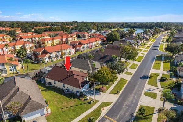 an aerial view of residential houses with outdoor space