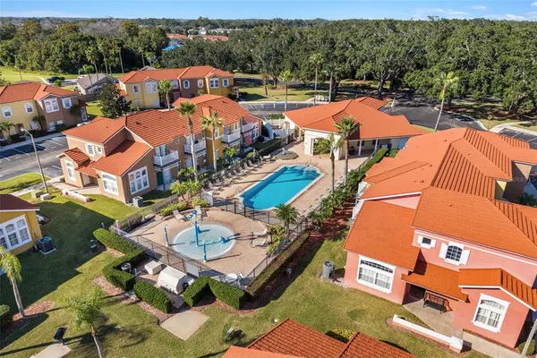 an aerial view of a houses with a lake view