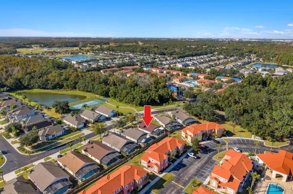 an aerial view of a house having swimming pool