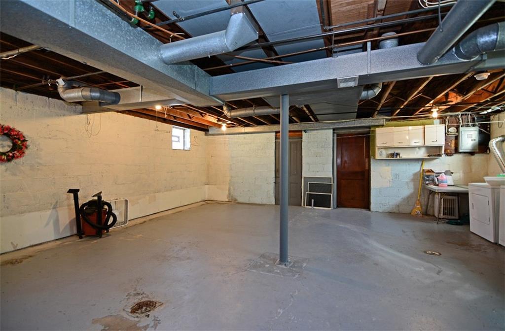 6902 Shannon Road Verona, PA 15147 - Photo 13 of 15 The versatile basement features a standard-height ceiling, plus a workshop room and storage room.