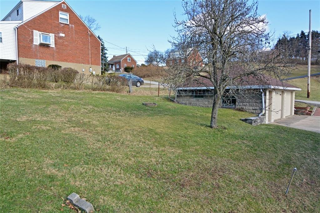6902 Shannon Road Verona, PA 15147 - Photo 14 of 15 The spacious back yard sits between the house and driveway/garage.