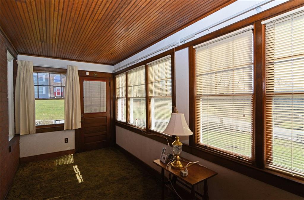 6902 Shannon Road Verona, PA 15147 - Photo 4 of 15 The enclosed front porch is a versatile space, flowing with abundant natural light.