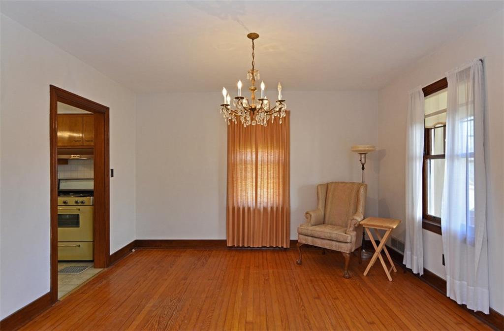 6902 Shannon Road Verona, PA 15147 - Photo 5 of 15 The formal dining room offers oak hardwood flooring and a crystal chandelier.