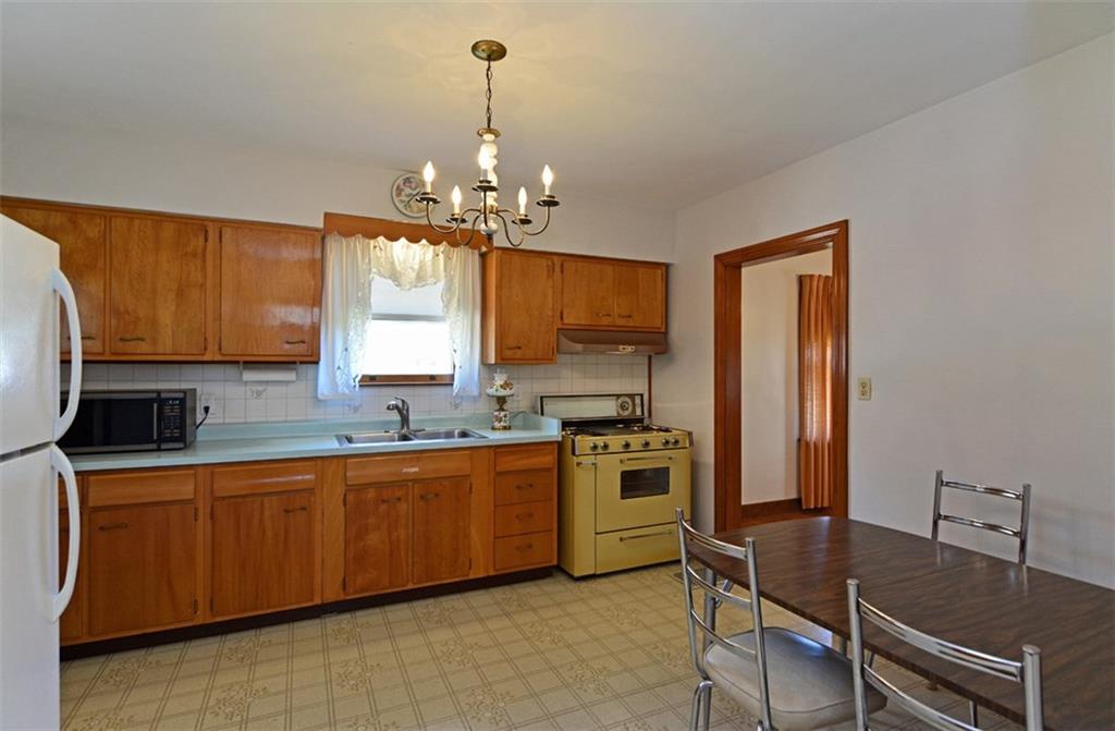 6902 Shannon Road Verona, PA 15147 - Photo 8 of 15 The kitchen offers ample cabinetry and a sizable dining space.