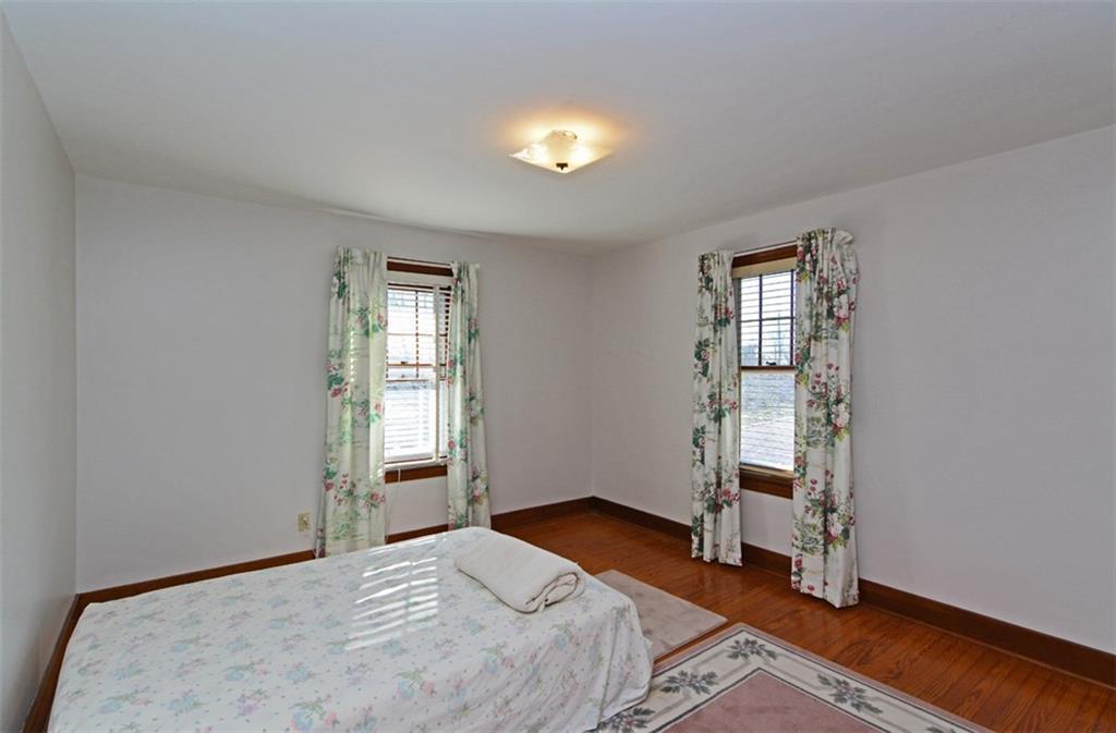 6902 Shannon Road Verona, PA 15147 - Photo 10 of 15 The second bedroom also provides hardwood flooring and a cedar closet.