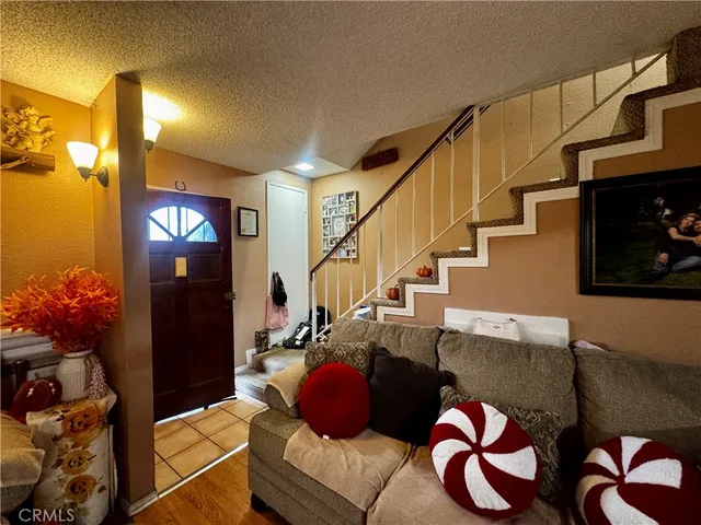 a living room with furniture and flowers