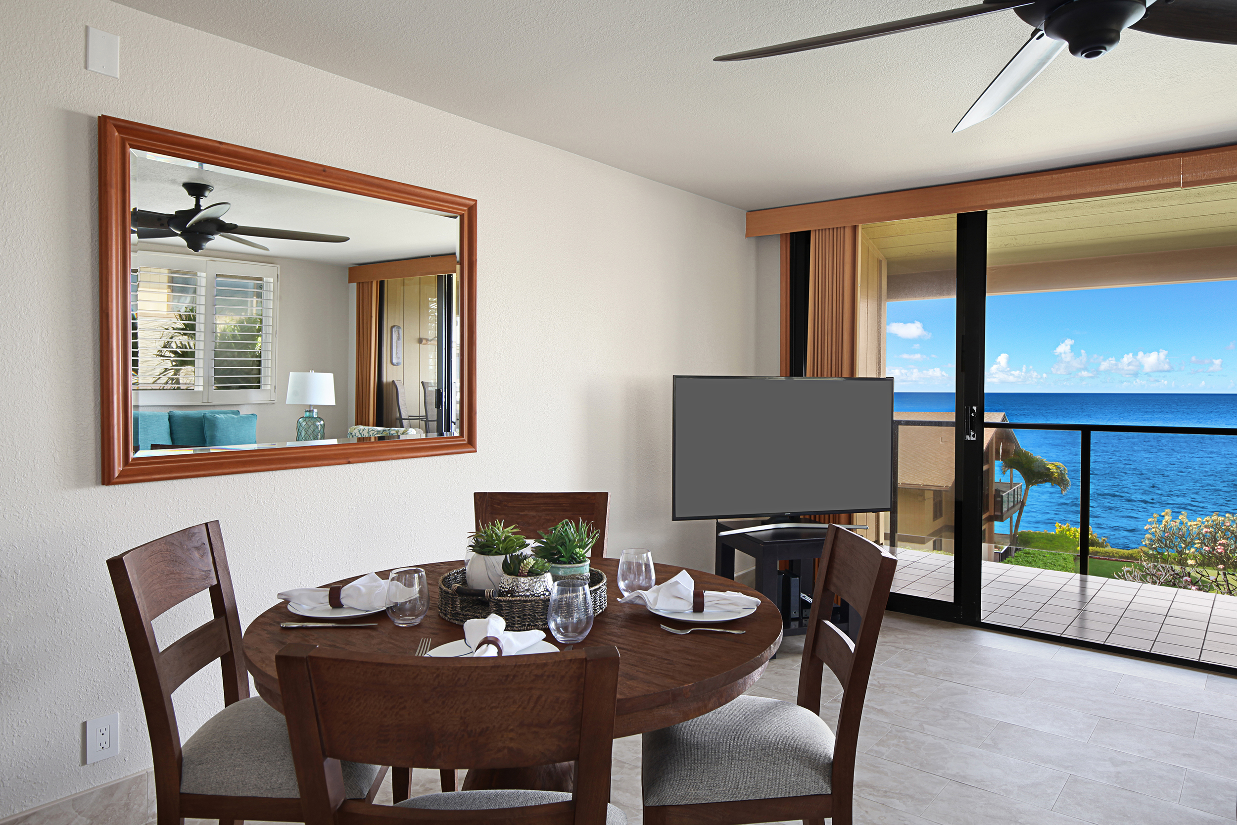 1661 Pee Road, Unit IIA312 Koloa, HI 96756 - Photo 3 of 30 a dining room with furniture and wooden floor