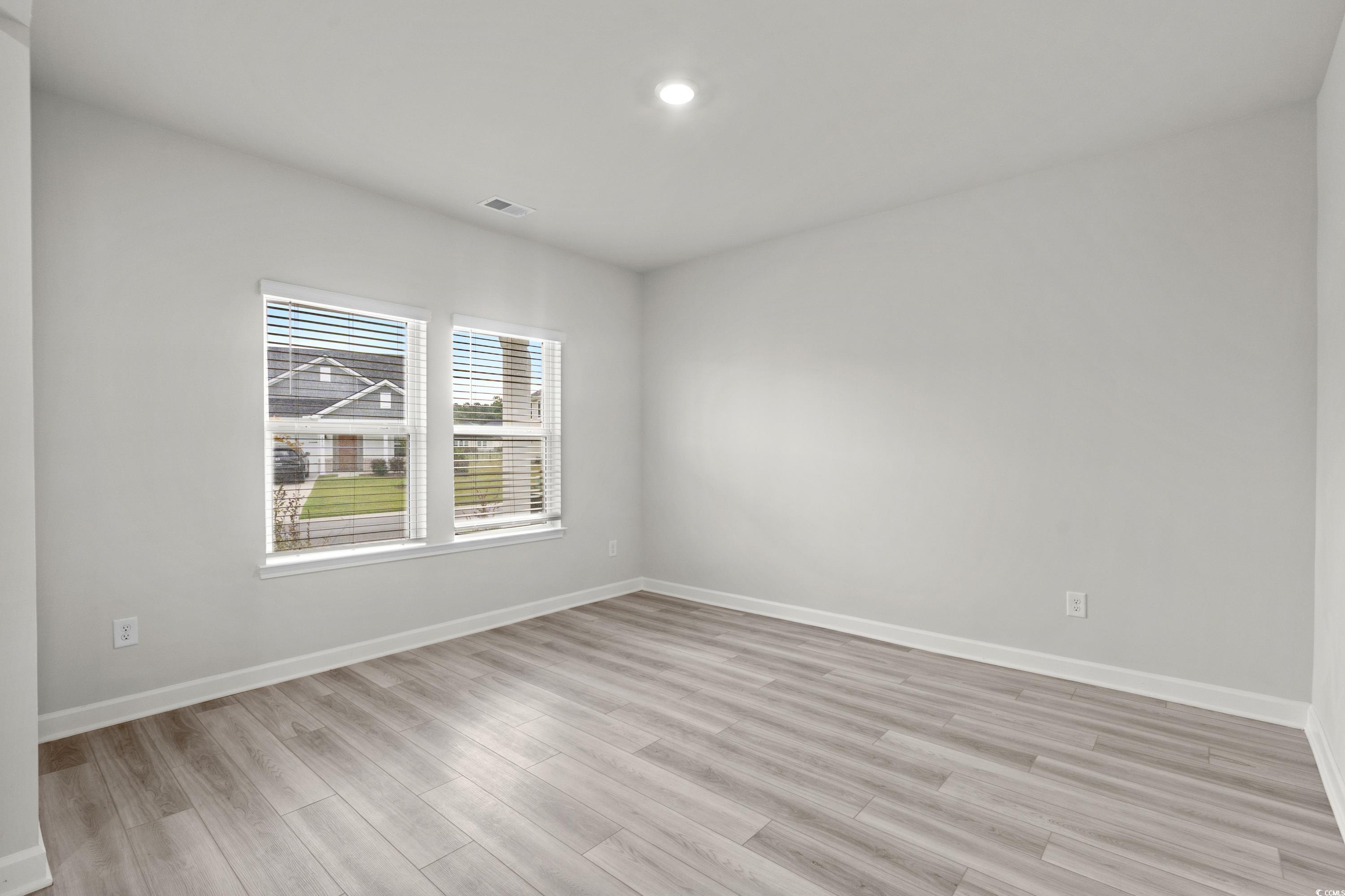 2409 Copper Crk Loop Longs, SC 29568 - Photo 20 of 40 Empty room with light wood-type flooring and recessed lighting