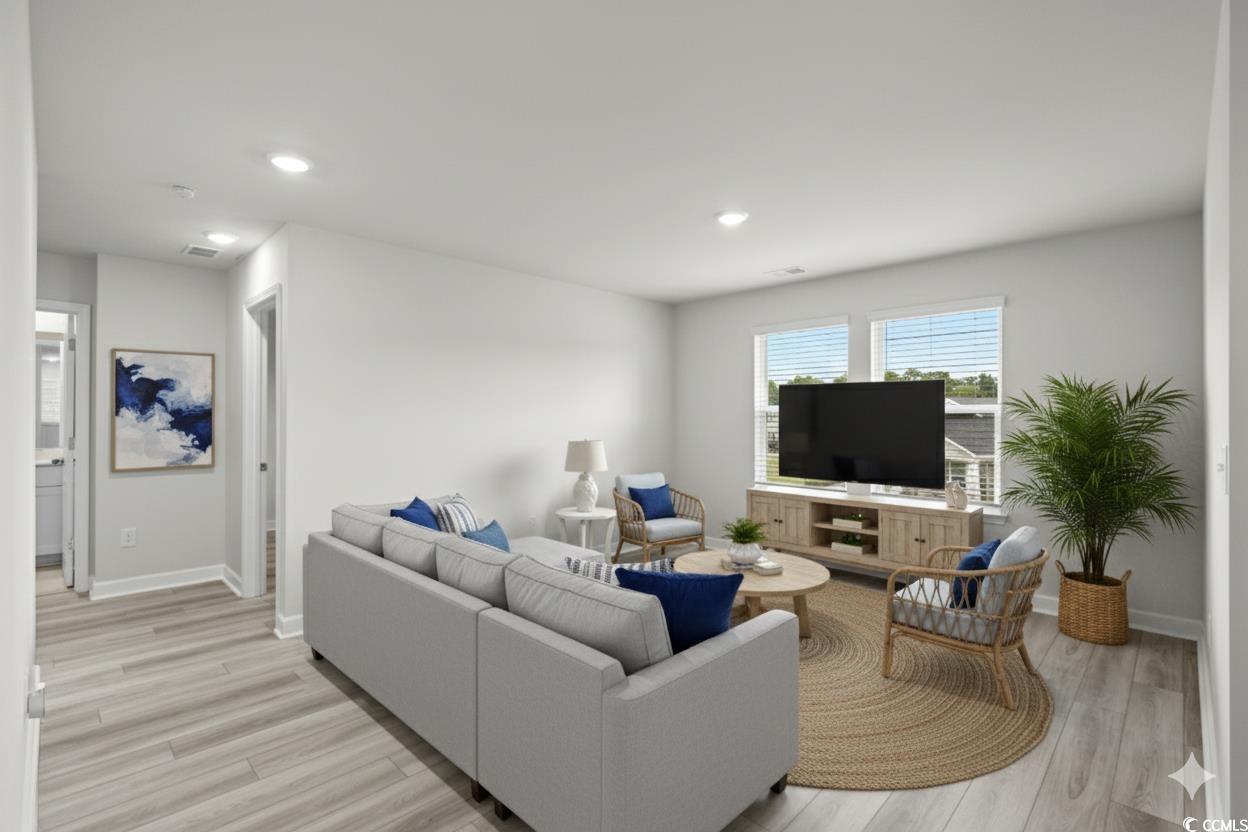 2409 Copper Crk Loop Longs, SC 29568 - Photo 21 of 40 Virtually Staged - Living room featuring light wood-style flooring and recessed lighting