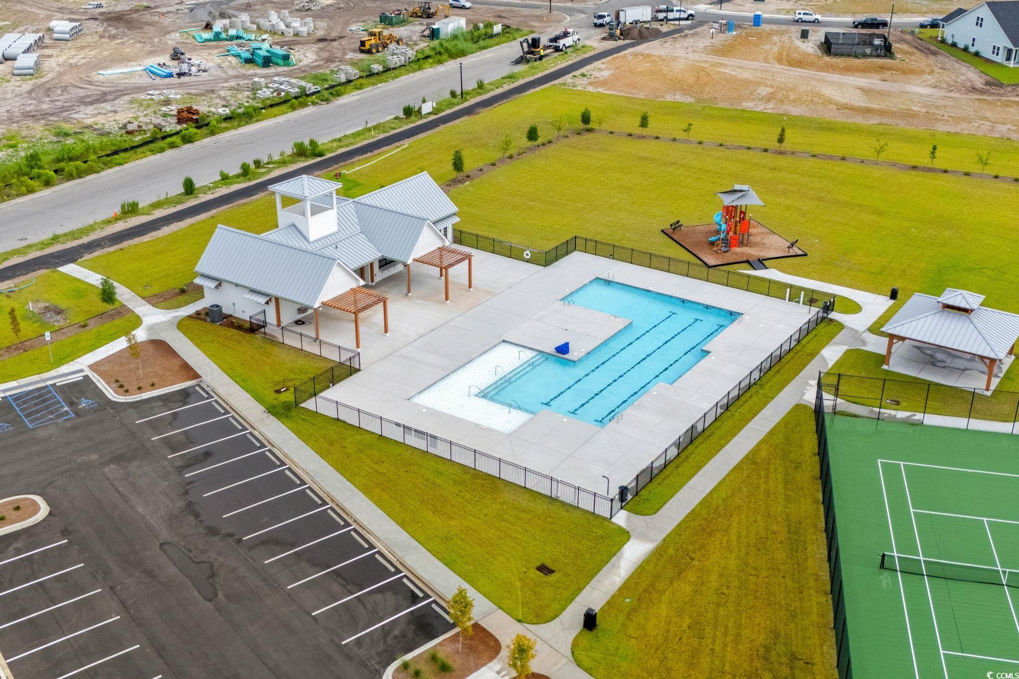 2409 Copper Crk Loop Longs, SC 29568 - Photo 25 of 40 Aerial view of a pool area