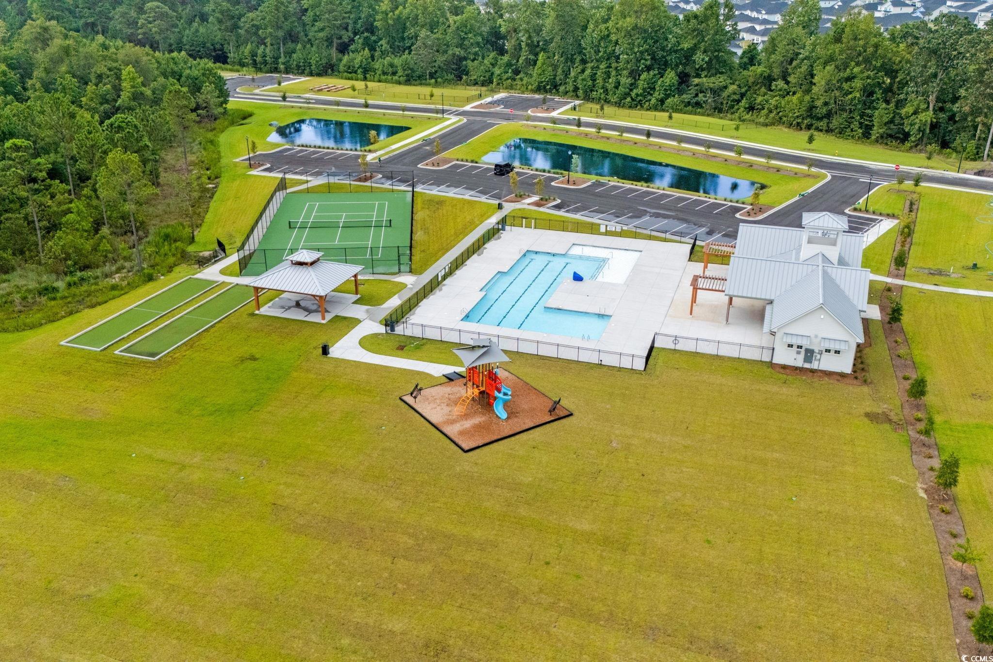 2409 Copper Crk Loop Longs, SC 29568 - Photo 33 of 40 Aerial view of a pool