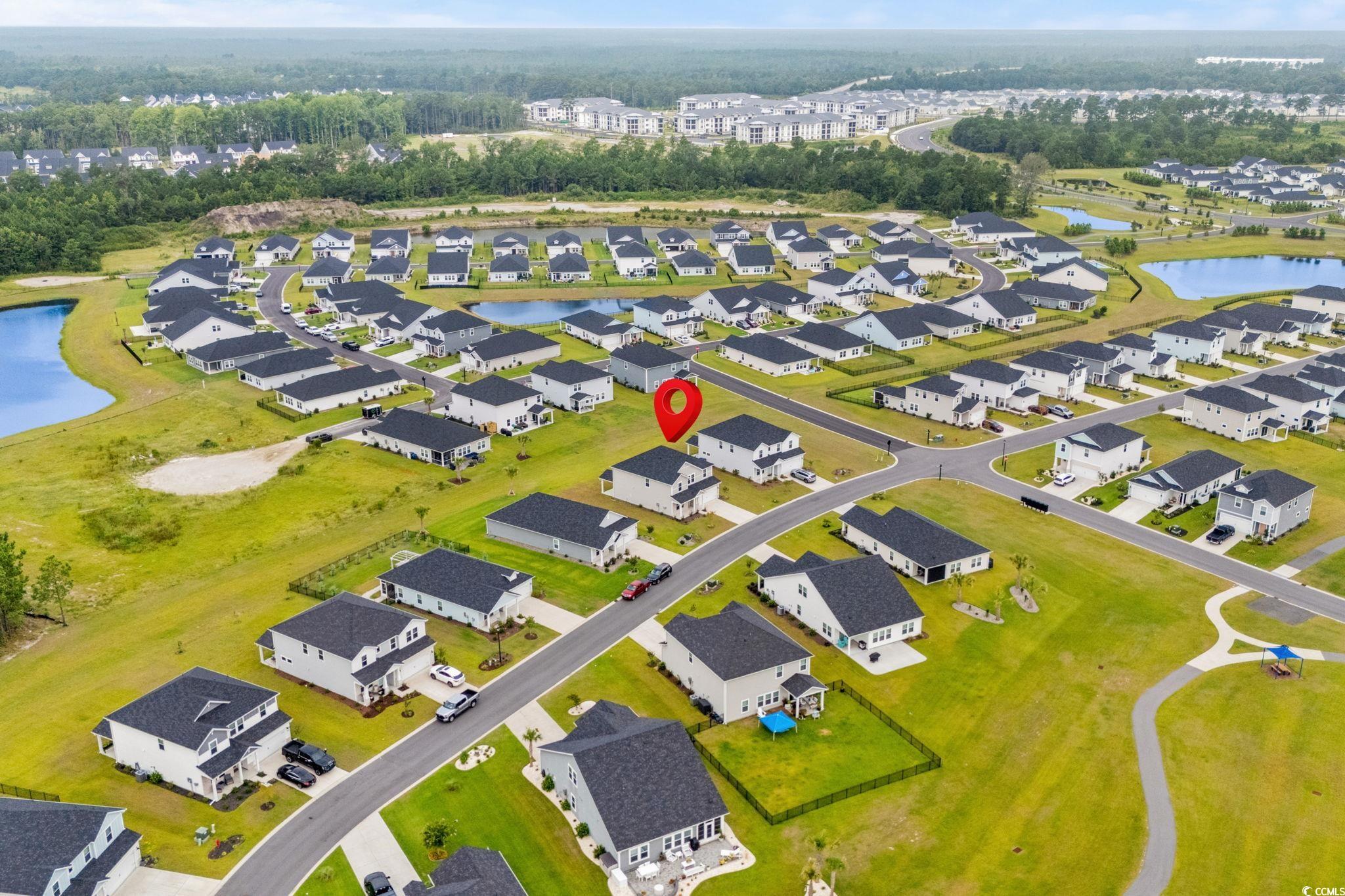 2409 Copper Crk Loop Longs, SC 29568 - Photo 4 of 40 Aerial view of residential area featuring a nearby body of water