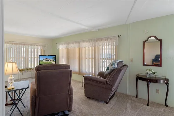 a kitchen with granite countertop a sink cabinets and window