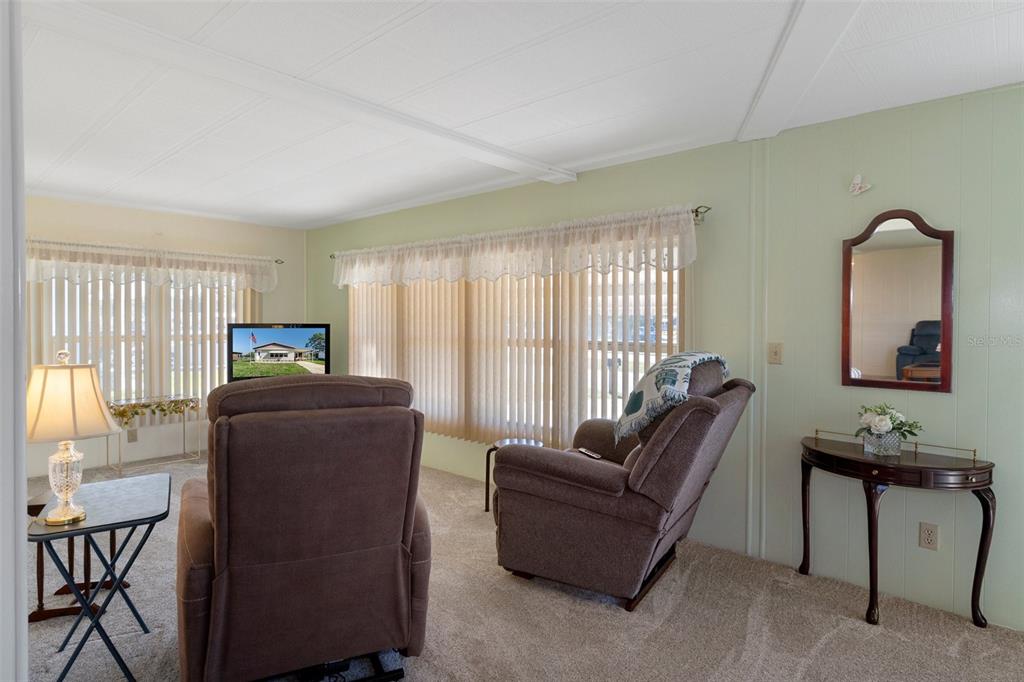 14751 Brookridge Boulevard Brooksville, FL 34613 - Photo 14 of 61 a living room with furniture and a window