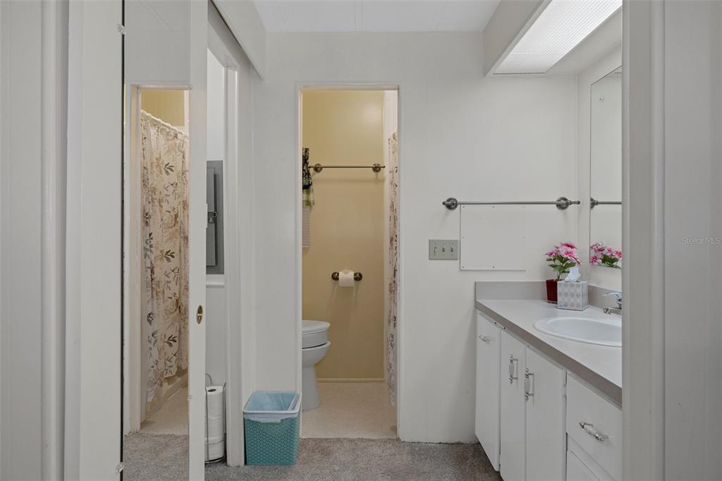 14751 Brookridge Boulevard Brooksville, FL 34613 - Photo 27 of 61 a bathroom with a sink and a mirror