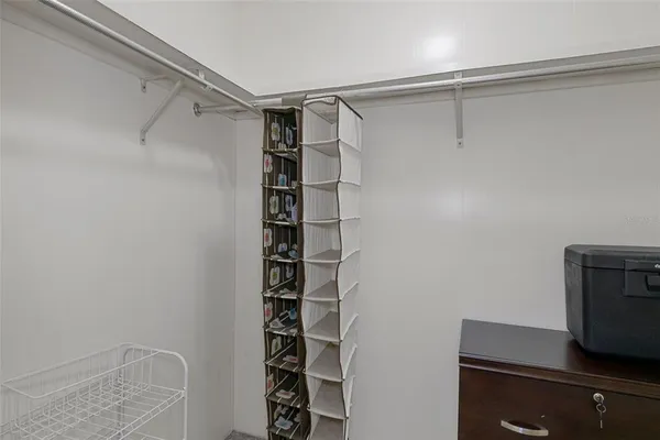 a bedroom with a bed and a table in it