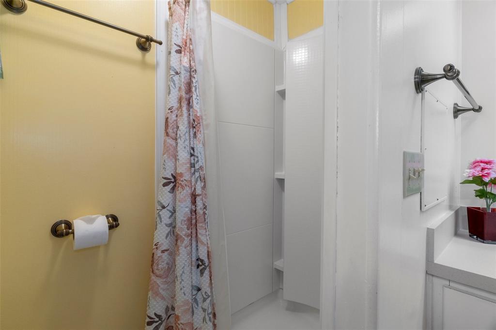 14751 Brookridge Boulevard Brooksville, FL 34613 - Photo 29 of 61 a bathroom with a shower curtain