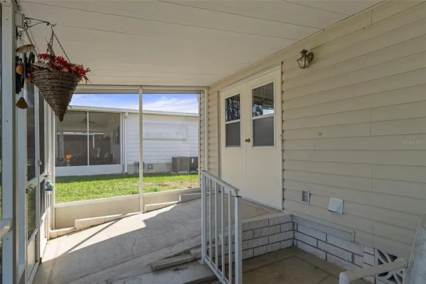 a view of a house with swimming pool and sitting area