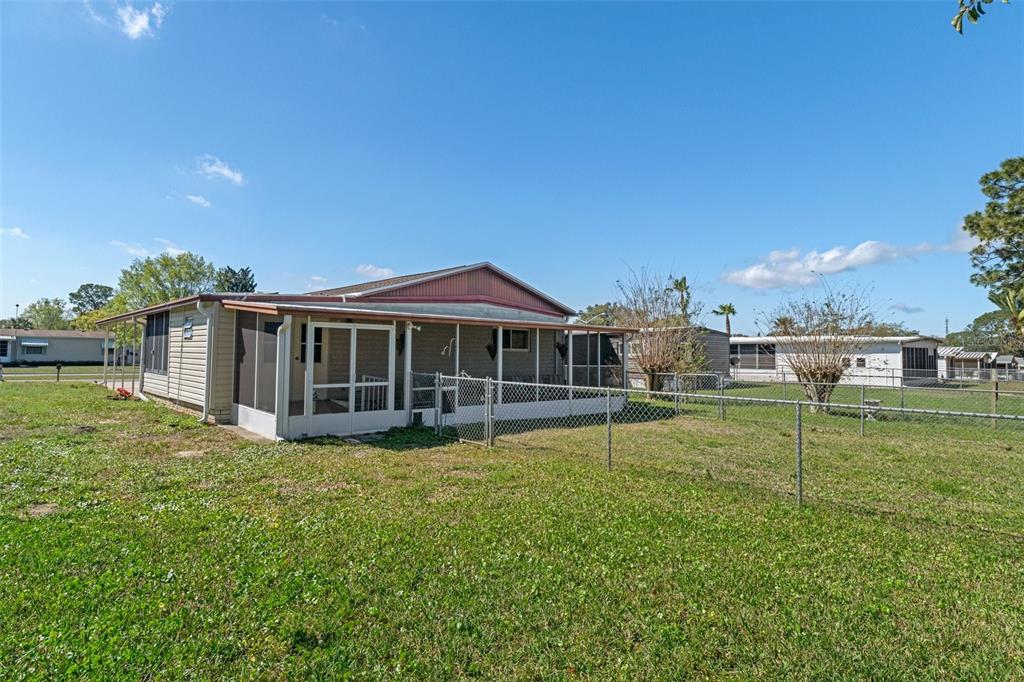 14751 Brookridge Boulevard Brooksville, FL 34613 - Photo 37 of 61 a view of a house with a yard