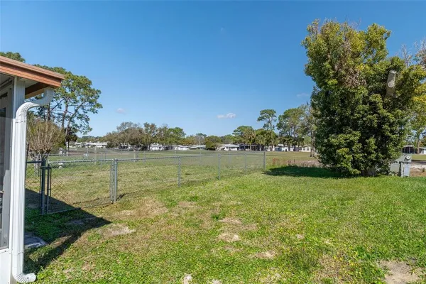 a view of a field with a big yard