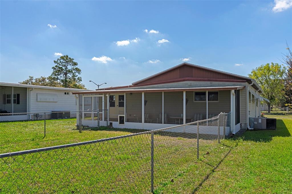 14751 Brookridge Boulevard Brooksville, FL 34613 - Photo 41 of 61 a view of a house with swimming pool and sitting area