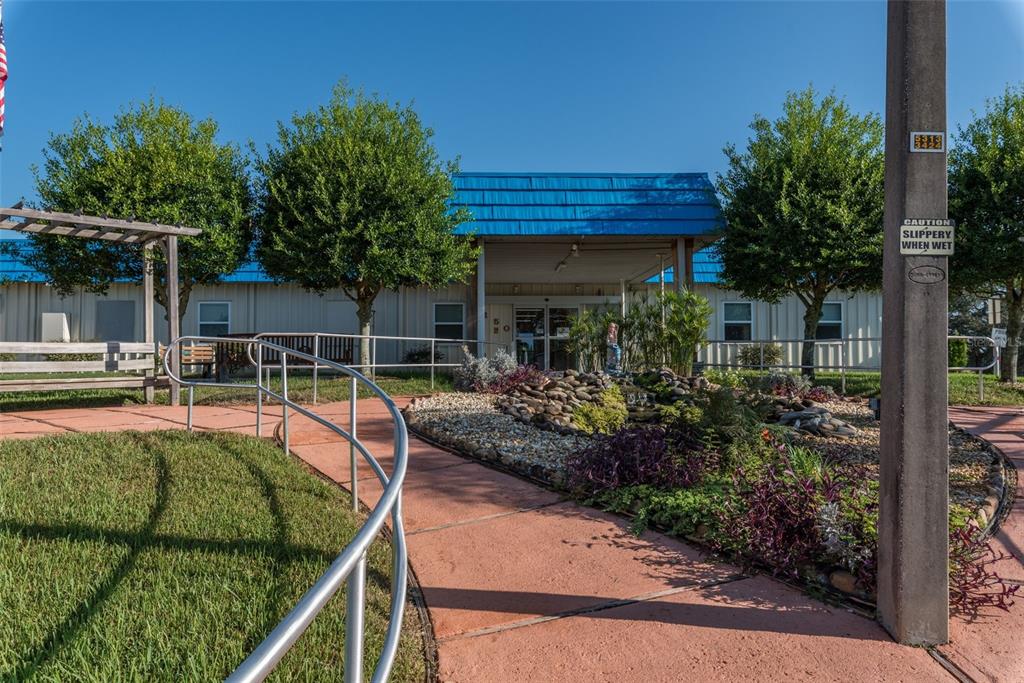 14751 Brookridge Boulevard Brooksville, FL 34613 - Photo 48 of 61 a view of a house with backyard and sitting area