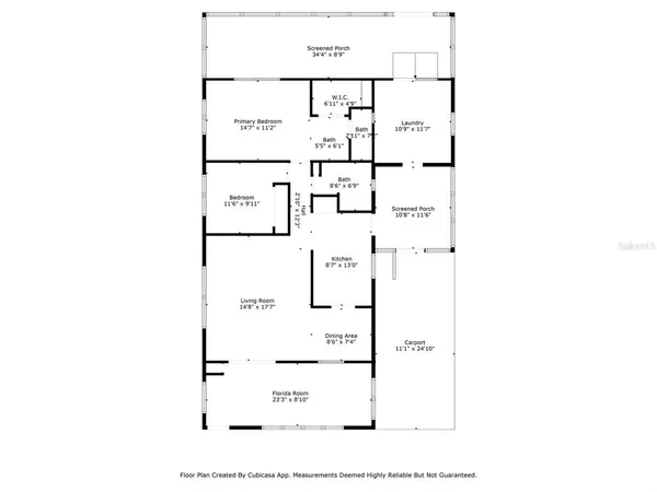 a living room with furniture and flowers
