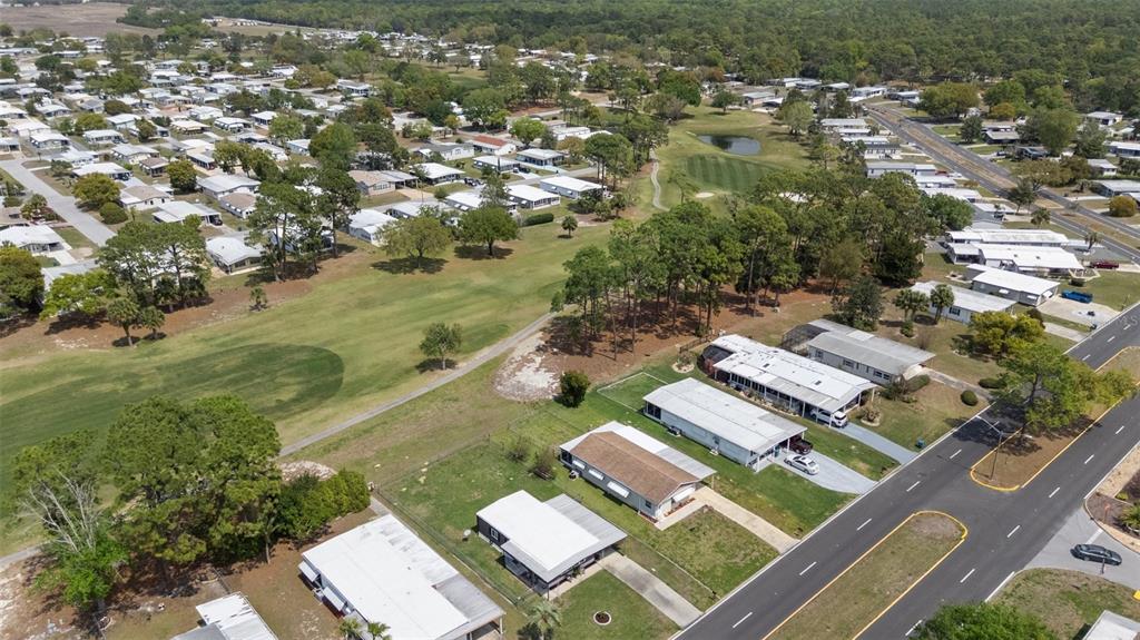 14751 Brookridge Boulevard Brooksville, FL 34613 - Photo 57 of 61 an aerial view of residential houses with outdoor space