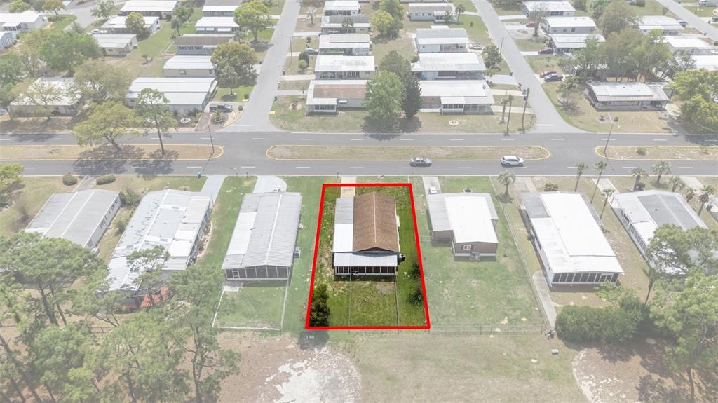 14751 Brookridge Boulevard Brooksville, FL 34613 - Photo 58 of 61 a room with a balcony a bed and a balcony view