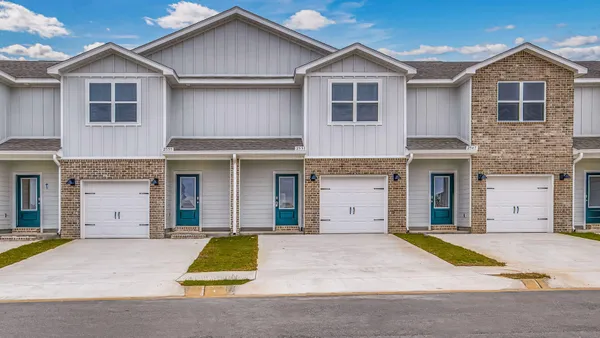 a view of a yard in front of a house