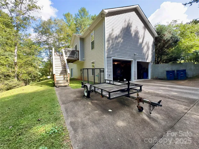 a view of a patio with a table and chairs