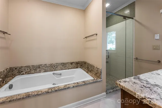a bathroom with a tub and a sink